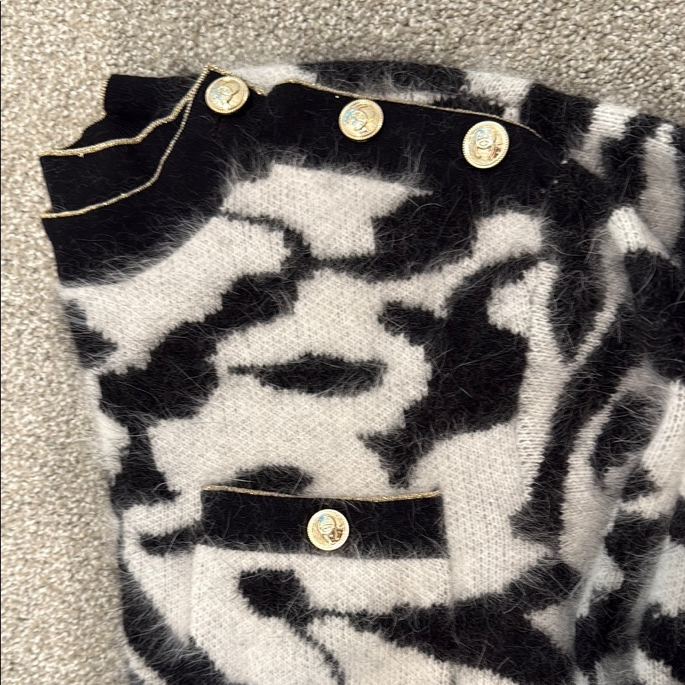 Stylish Black and White Sweater with gold trim and gold buttons